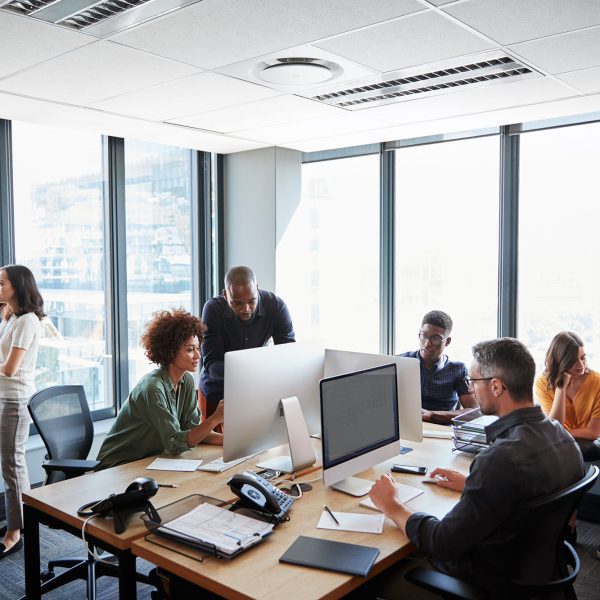 creative-business-team-working-together-in-a-busy-2024-10-19-03-14-38-utc