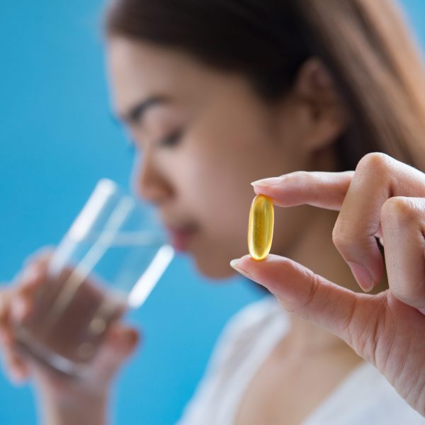 woman hand holding a pills take medicine according to the doctor's order